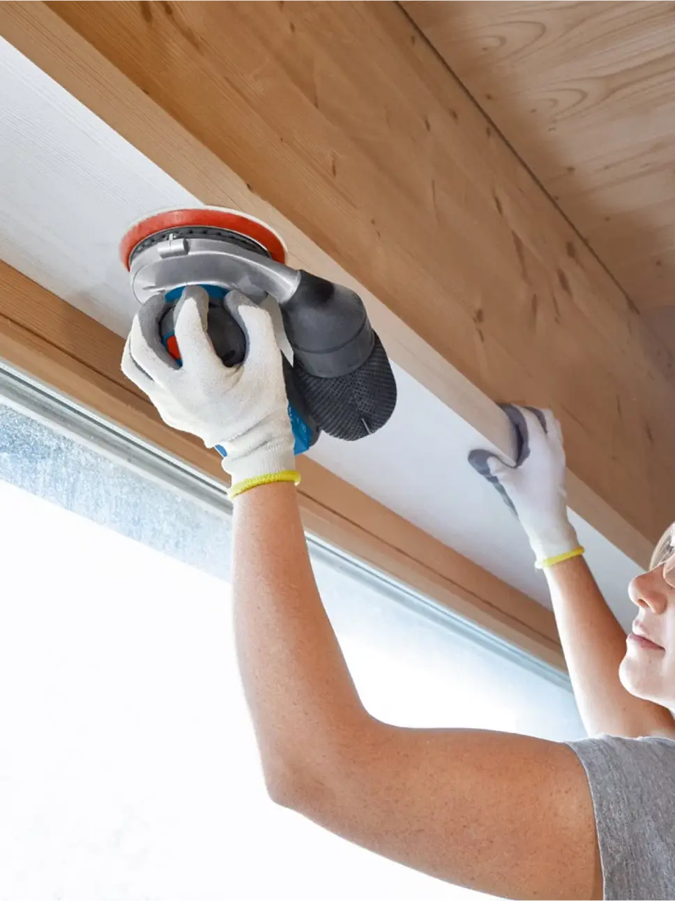 a person finishing the wood corner